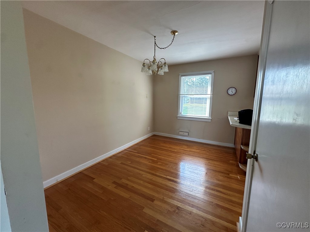 3415 Virginia Street Hopewell, VA 23860 - Photo 6 of 24 a view of empty room with wooden floor and fan