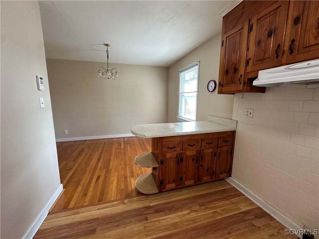3415 Virginia Street Hopewell, VA 23860 - Photo 7 of 24 a room with wooden floor and cabinets