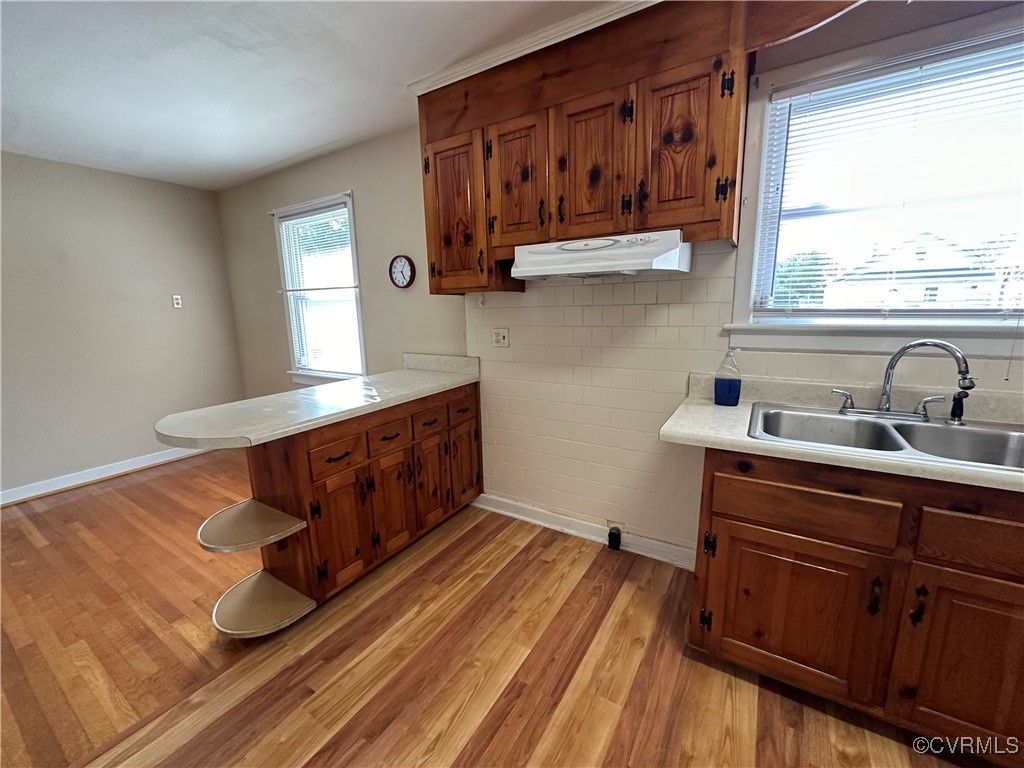 3415 Virginia Street Hopewell, VA 23860 - Photo 8 of 24 a kitchen with wooden cabinets and sink