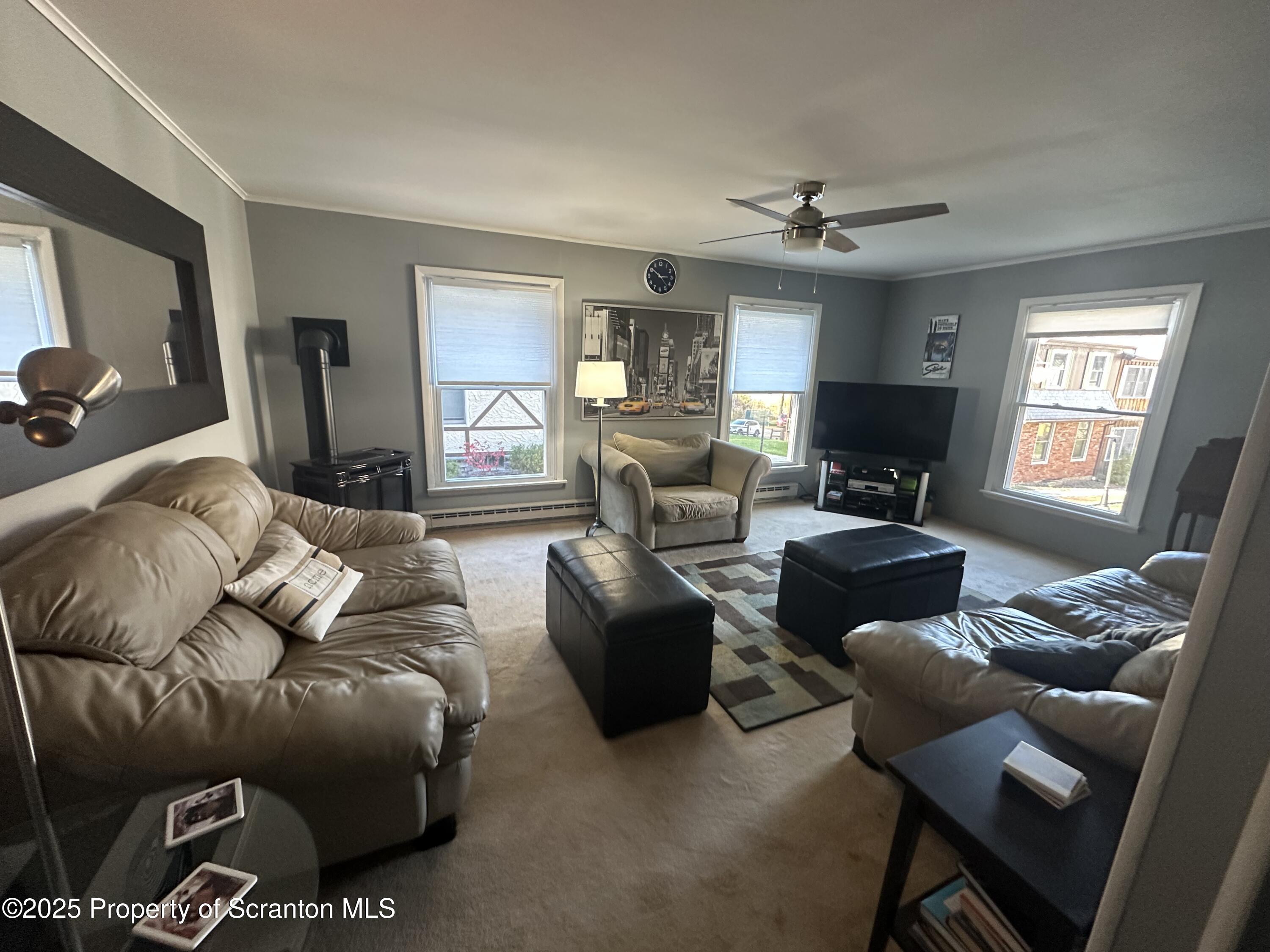 R-1 Ralph Lomma Way Union Dale, PA 18470 - Photo 12 of 25 a living room with furniture ceiling fan and a window