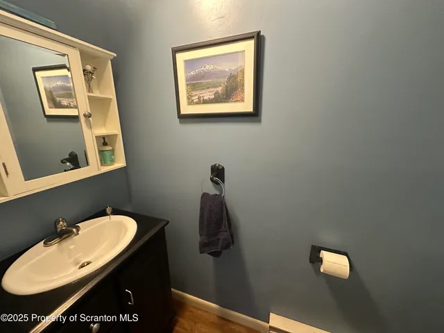 a bathroom with a sink and mirror