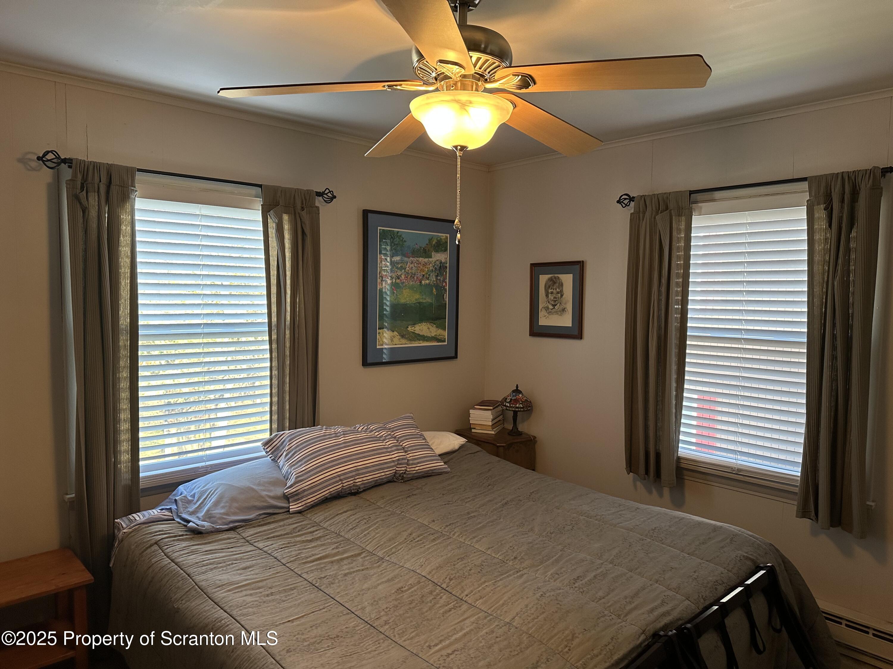 R-1 Ralph Lomma Way Union Dale, PA 18470 - Photo 24 of 25 a bedroom with a bed and a chandelier