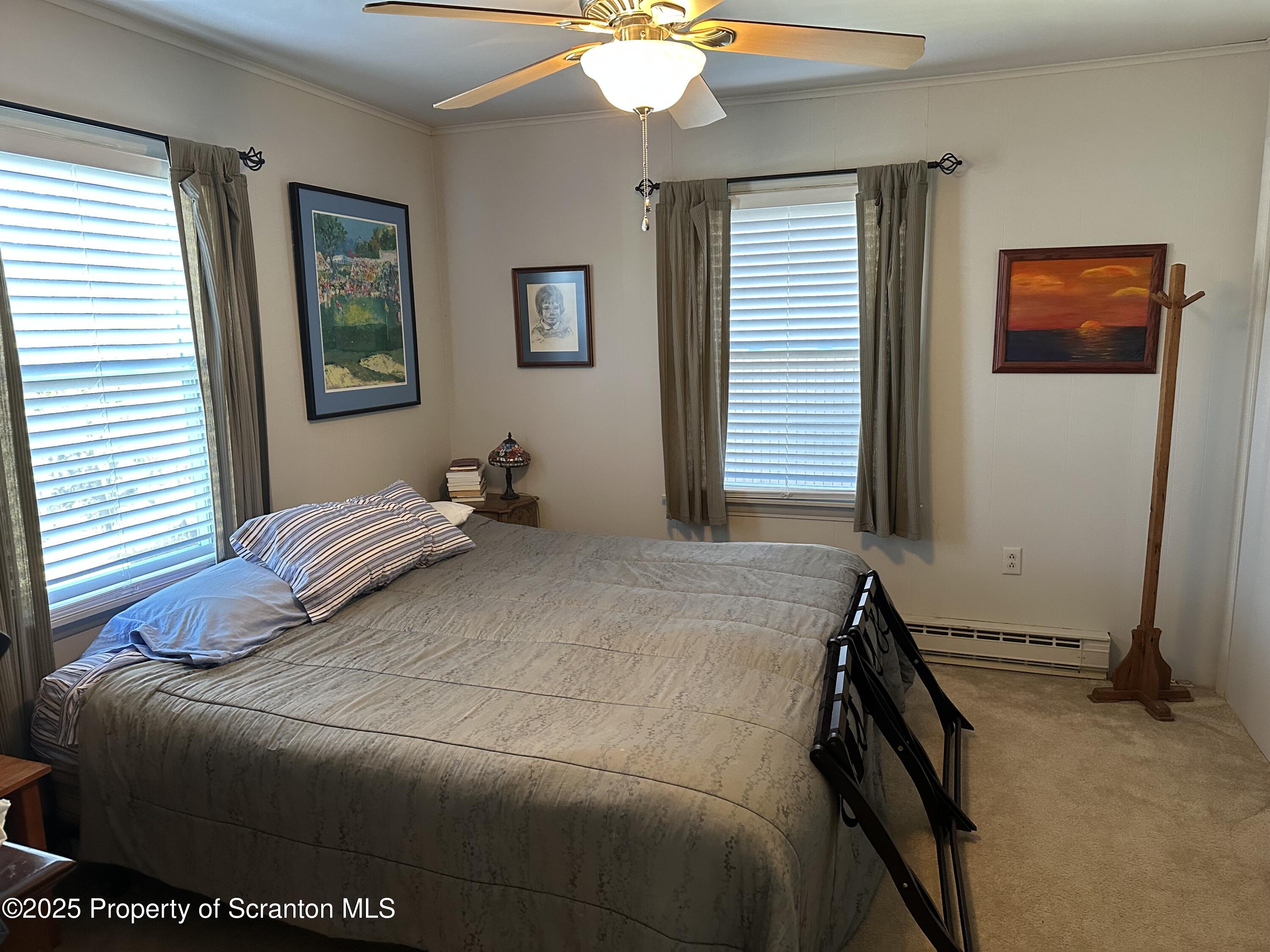 R-1 Ralph Lomma Way Union Dale, PA 18470 - Photo 25 of 25 a bedroom with a bed and a chandelier