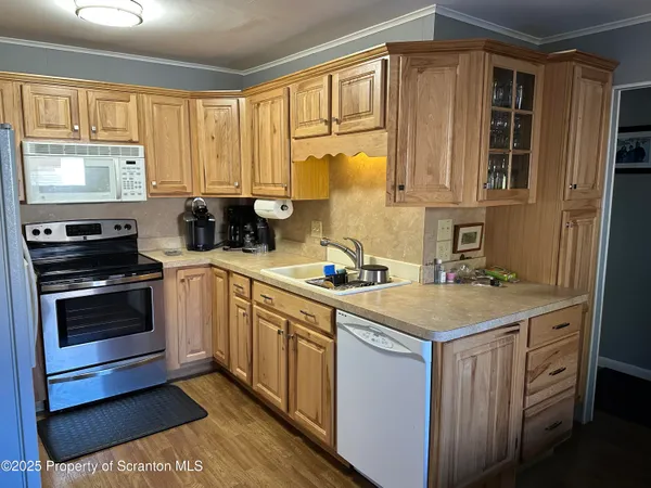 a kitchen that has a sink and a stove