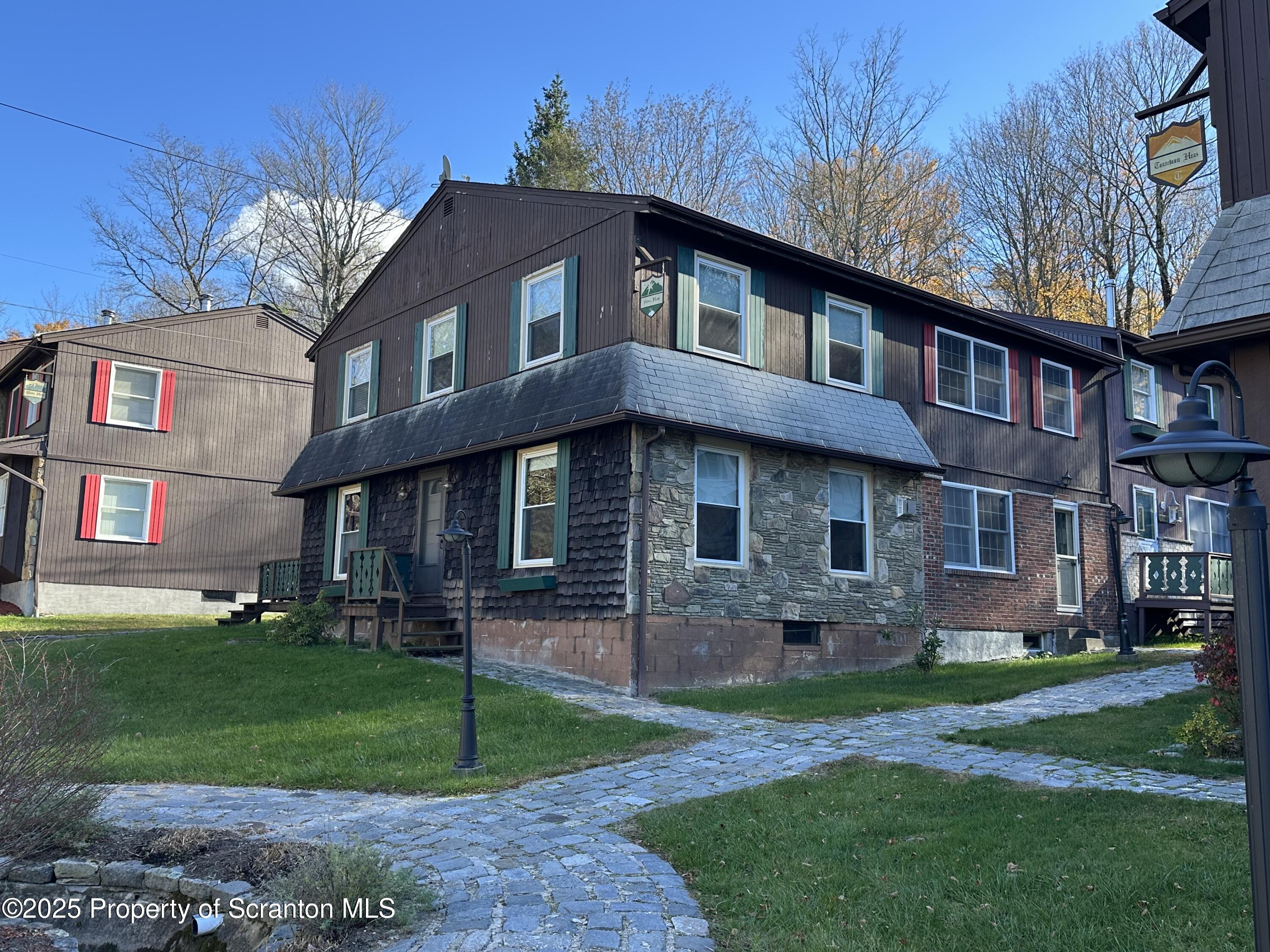 R-1 Ralph Lomma Way Union Dale, PA 18470 - Photo 9 of 25 a front view of a house with a yard