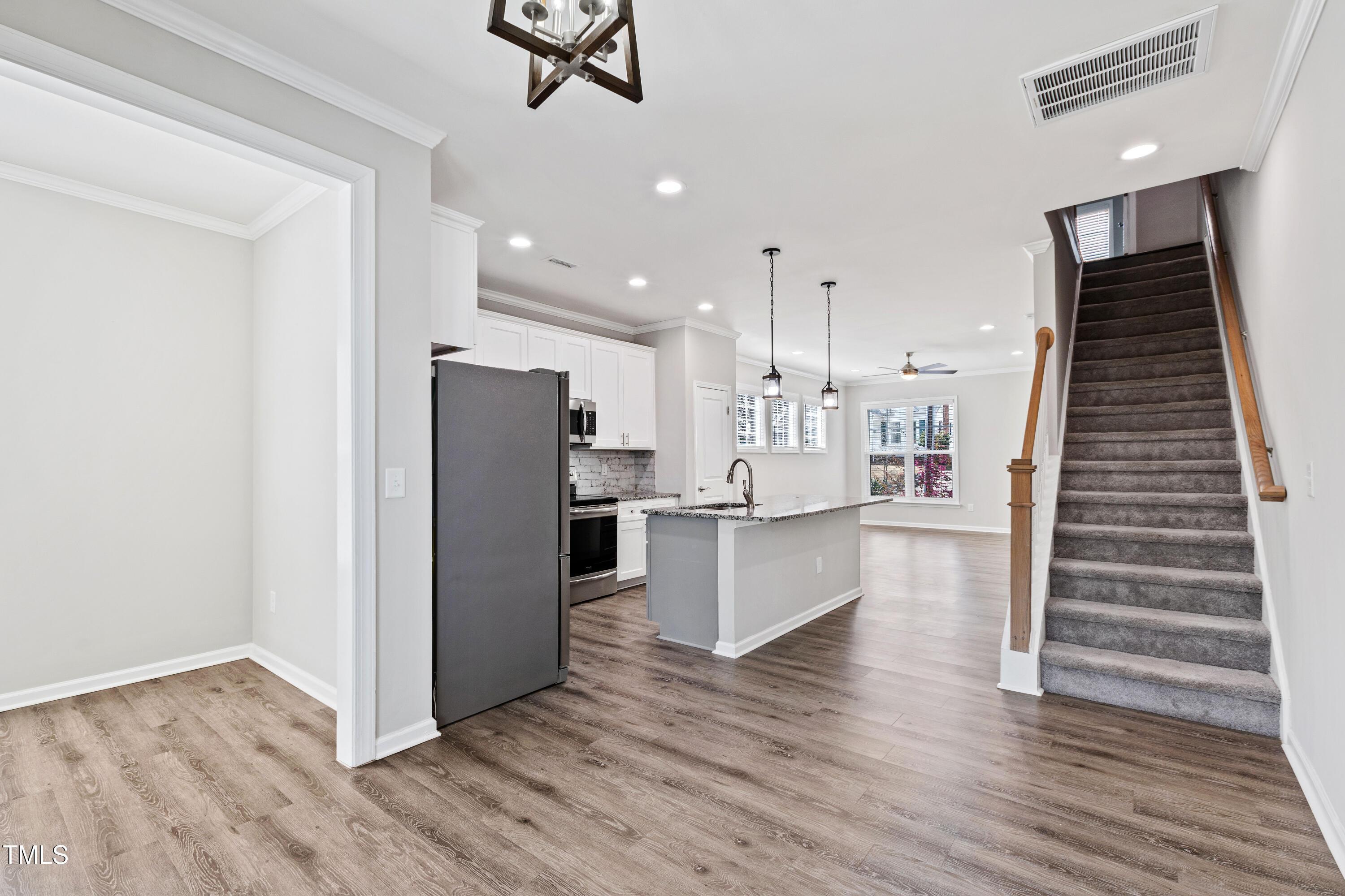 512 Spruce Street, Unit A Durham, NC 27703 - Photo 12 of 36 a view of kitchen with wooden floor and electronic appliances