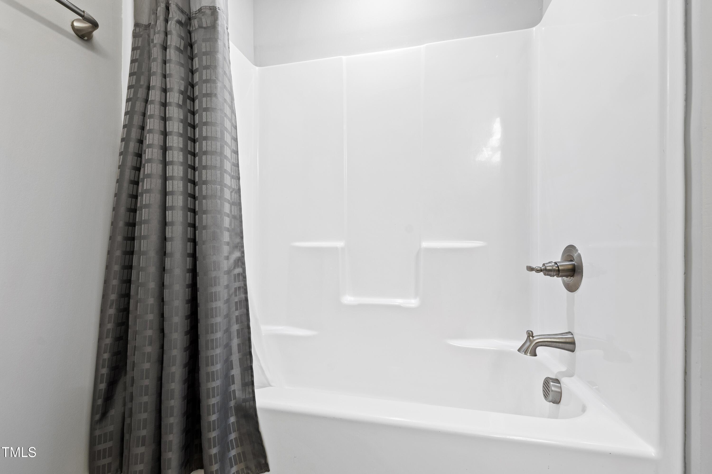 512 Spruce Street, Unit A Durham, NC 27703 - Photo 27 of 36 a bathroom with a bathtub