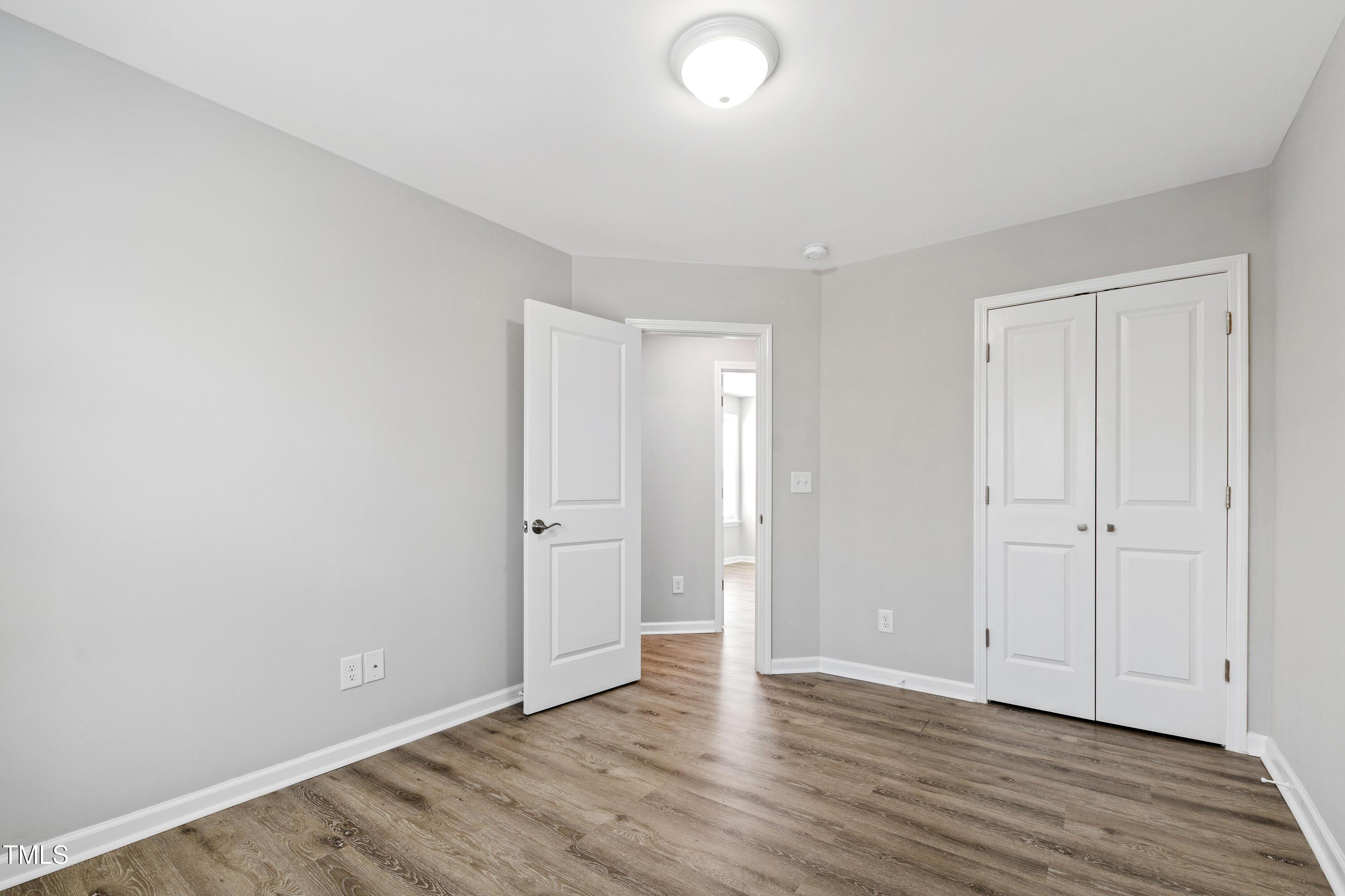 512 Spruce Street, Unit A Durham, NC 27703 - Photo 29 of 36 a view of an empty room with wooden floor