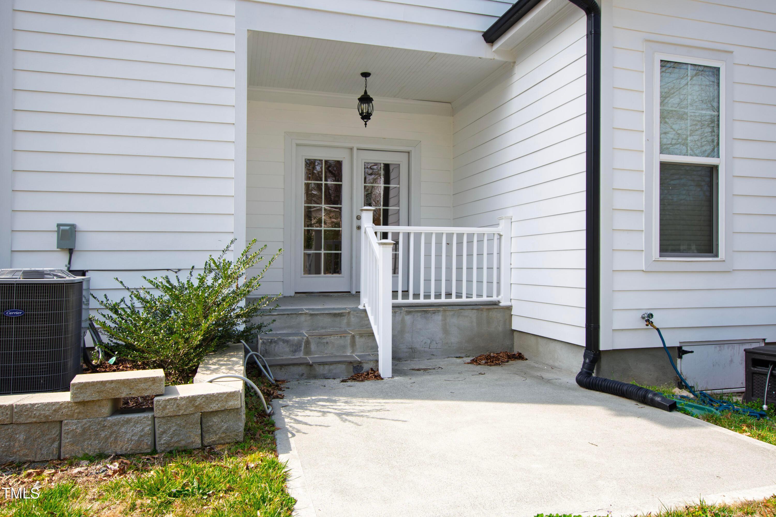 512 Spruce Street, Unit A Durham, NC 27703 - Photo 32 of 36 a potted plant sitting in front of a house