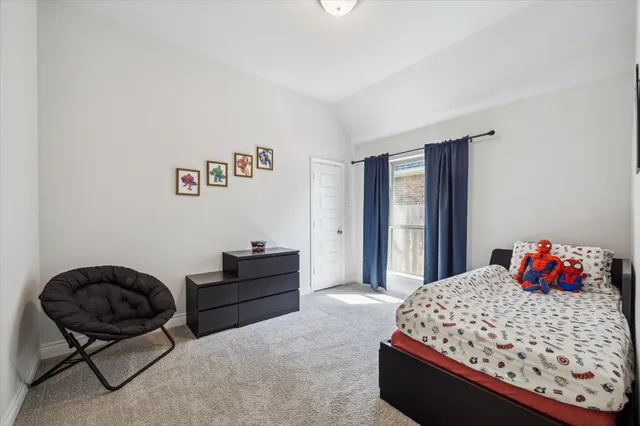 a bedroom with a bed and dresser