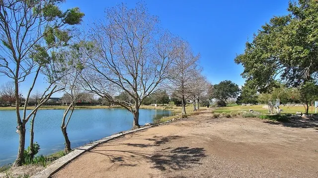 a view of a town with big trees