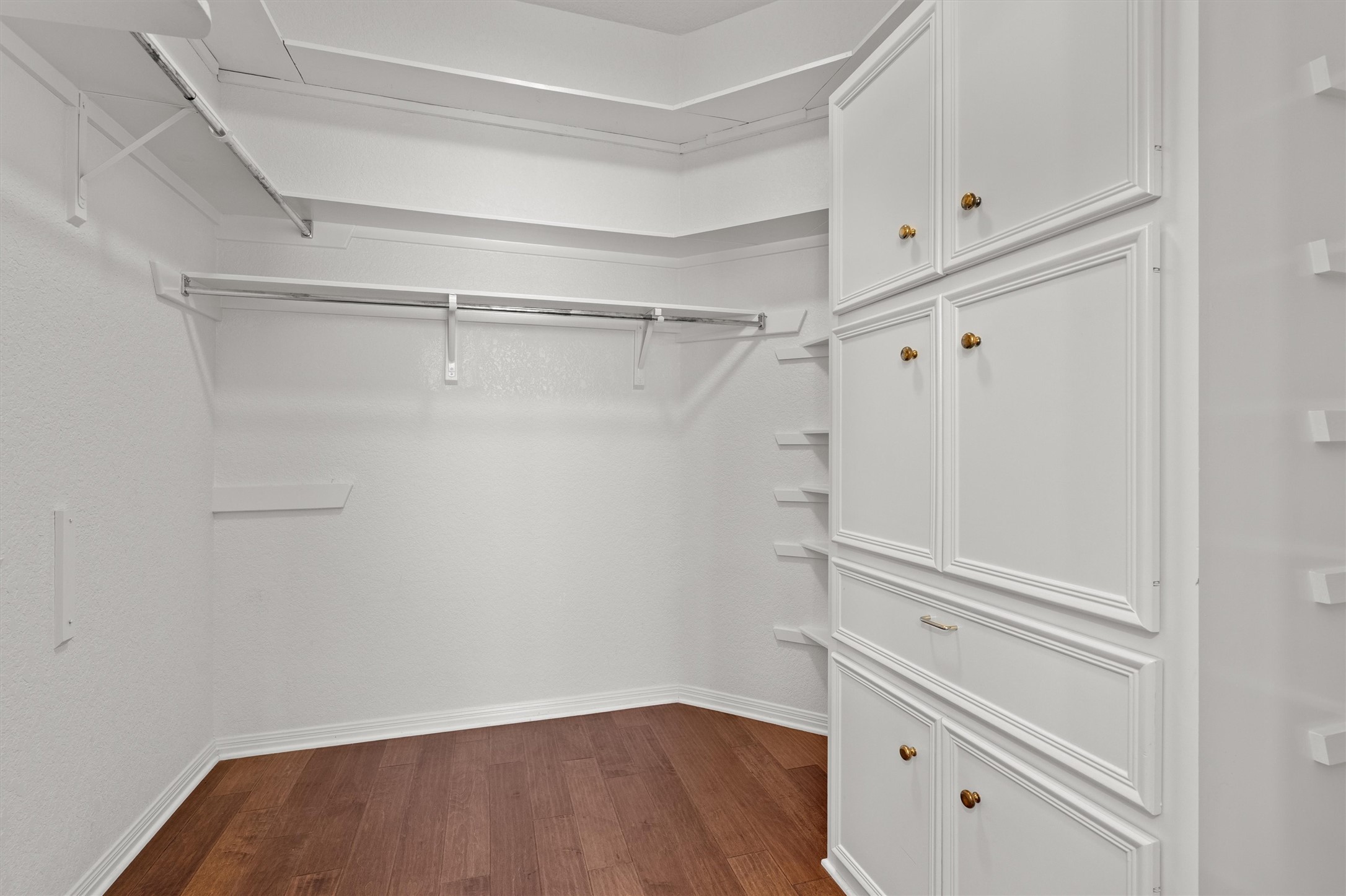 1014 Hackberry Drive Pflugerville, TX 78660 - Photo 20 of 38 The large primary closet covers all of your storage needs.