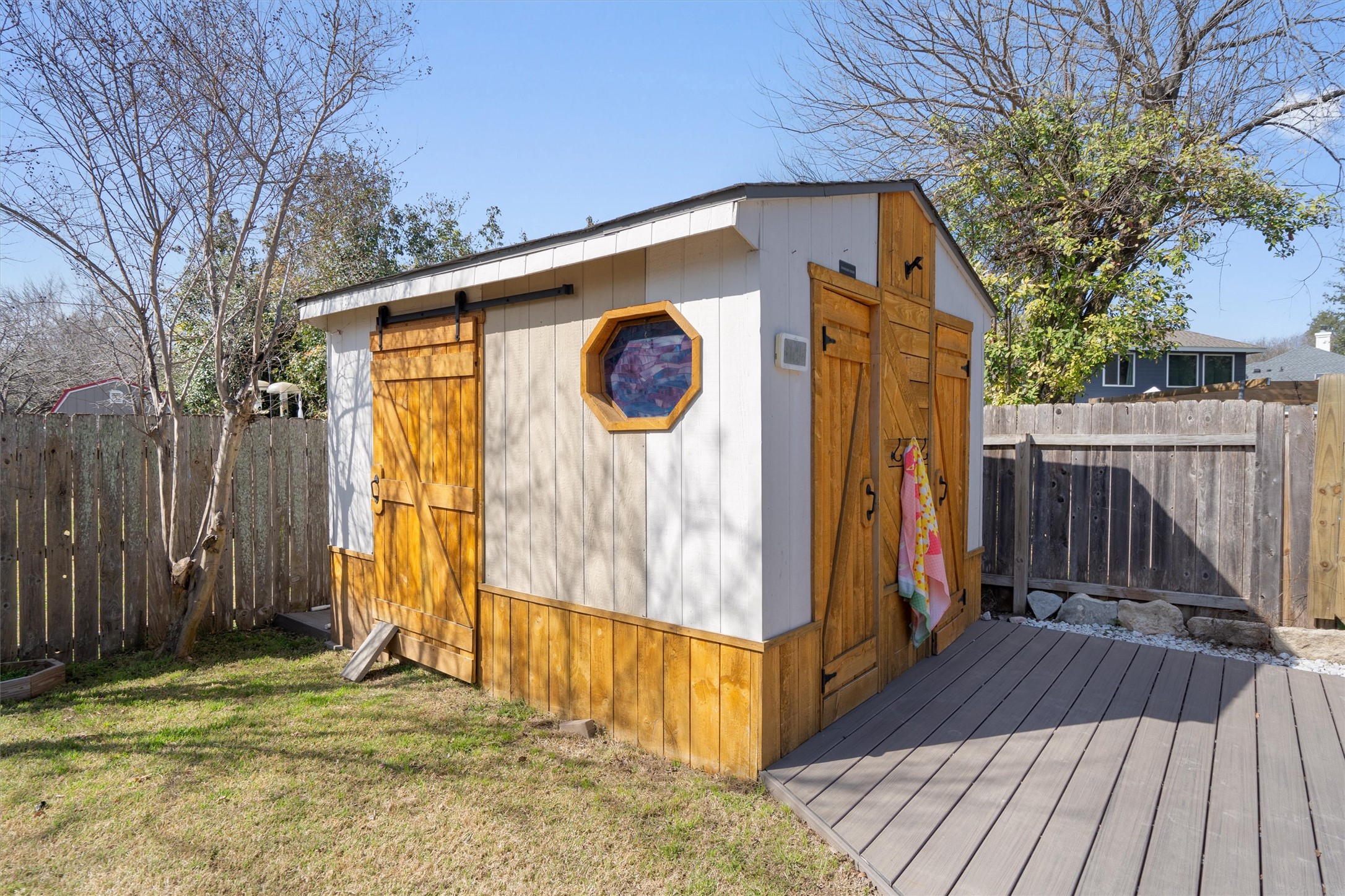 1014 Hackberry Drive Pflugerville, TX 78660 - Photo 31 of 36 a view of outdoor space with wooden floor and a large tree