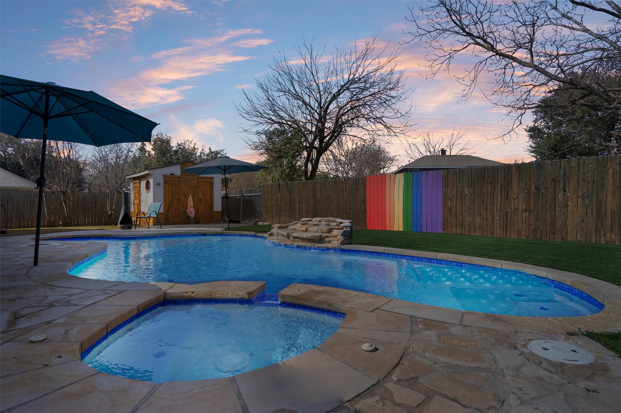 1014 Hackberry Drive Pflugerville, TX 78660 - Photo 34 of 38 Watch sunsets from the covered patio.