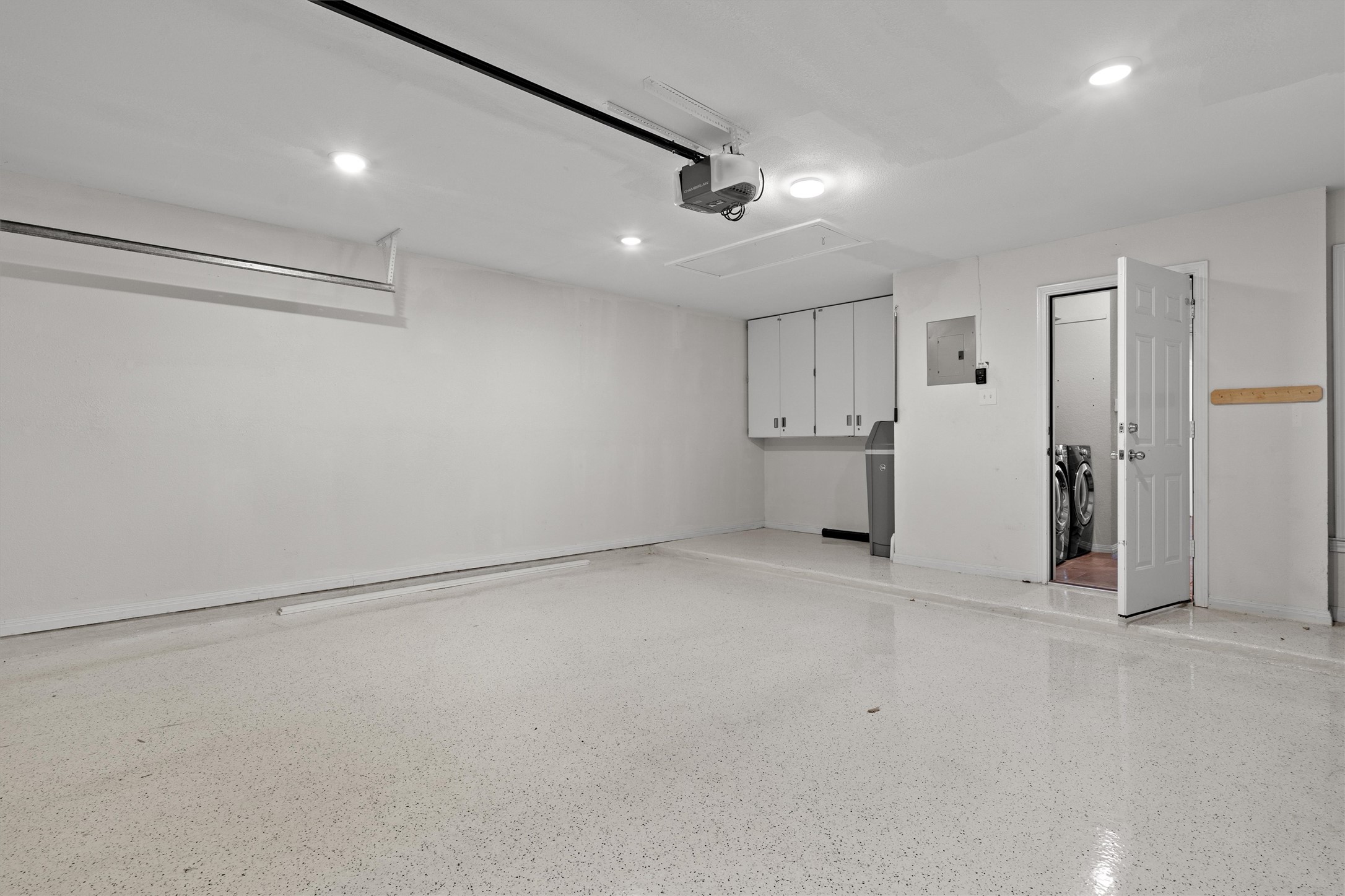 1014 Hackberry Drive Pflugerville, TX 78660 - Photo 35 of 38 The epoxied garage floor and extra storage finish off this high-end home.