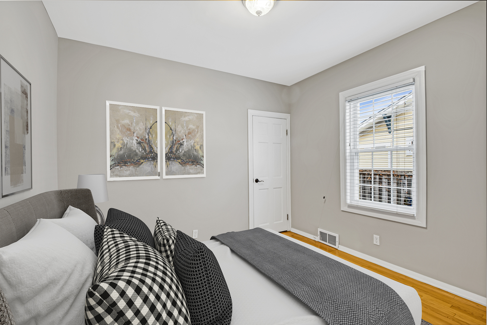 657 Chestnut Street Deerfield, IL 60015 - Photo 12 of 25 a bedroom with a bed and wooden floor