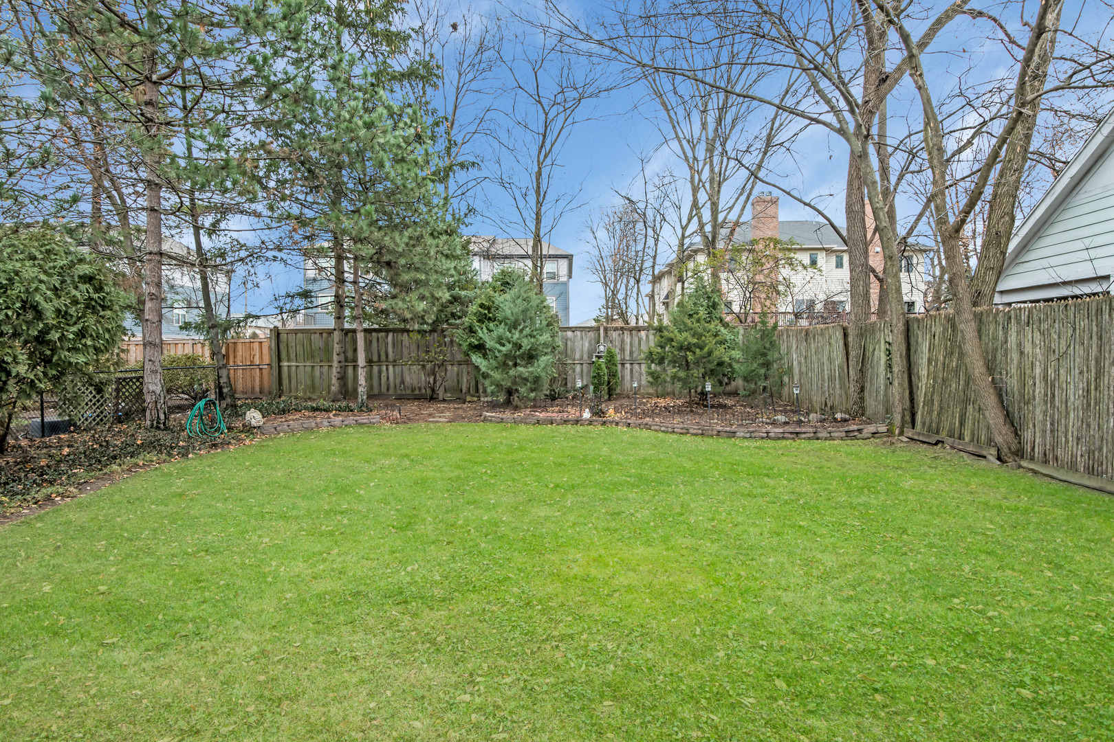 657 Chestnut Street Deerfield, IL 60015 - Photo 21 of 25 a view of a backyard with large trees