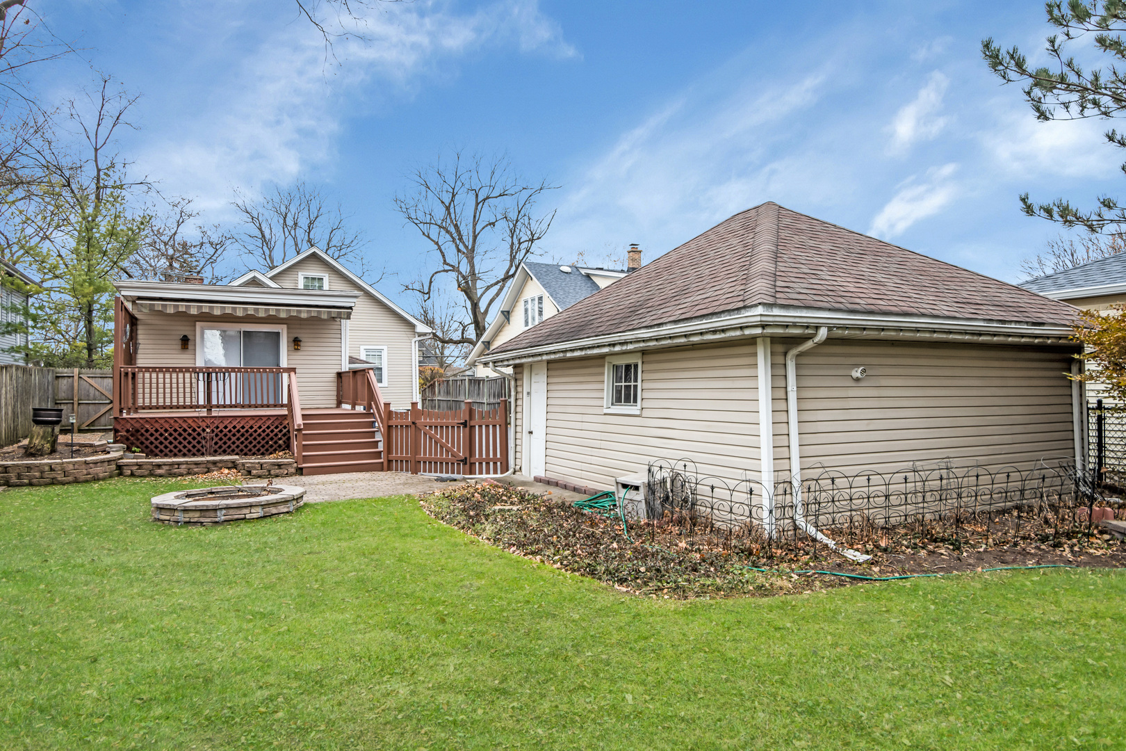 657 Chestnut Street Deerfield, IL 60015 - Photo 22 of 25 a front view of a house with a yard and trees