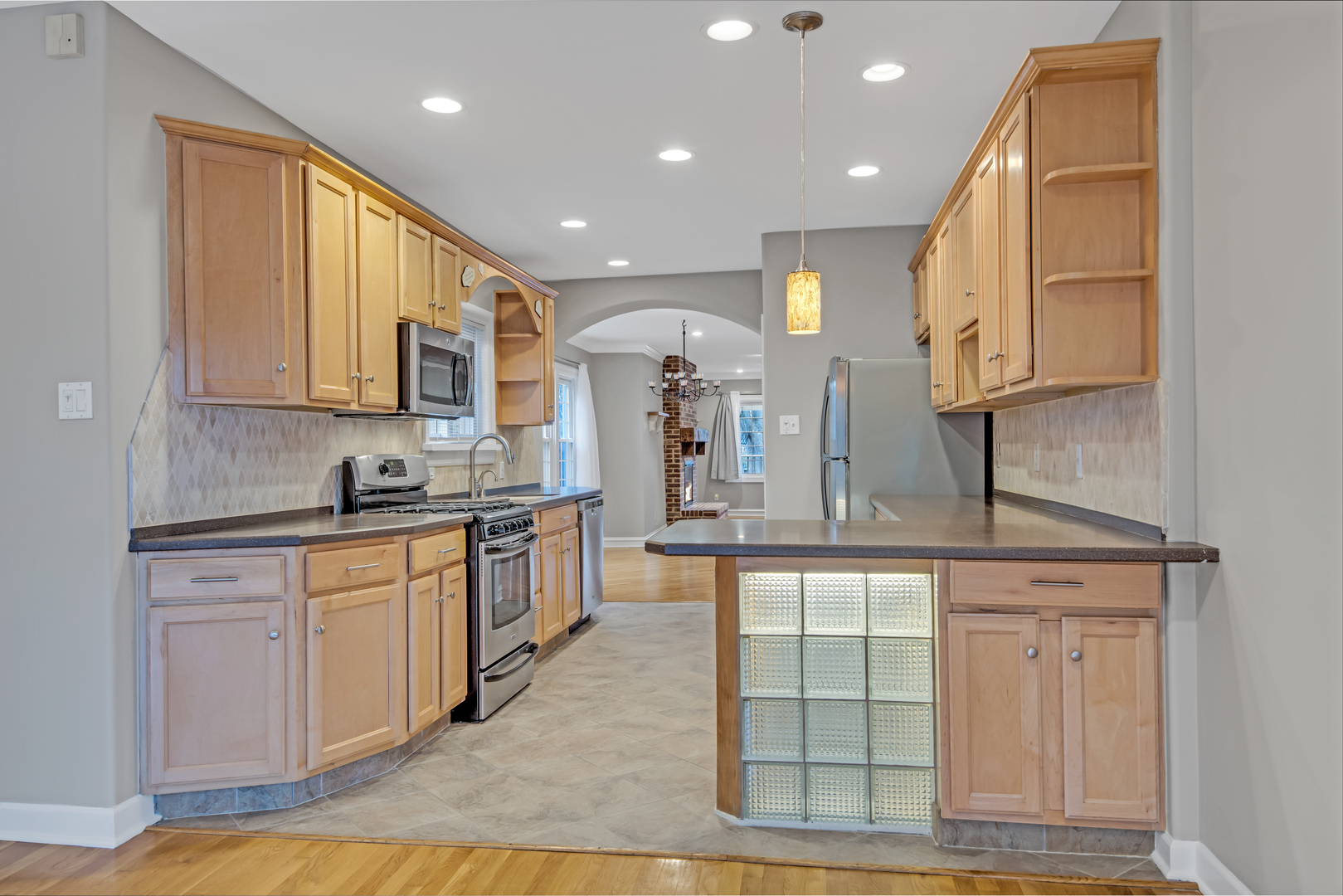 657 Chestnut Street Deerfield, IL 60015 - Photo 6 of 25 a large kitchen with stainless steel appliances granite countertop a sink and cabinets