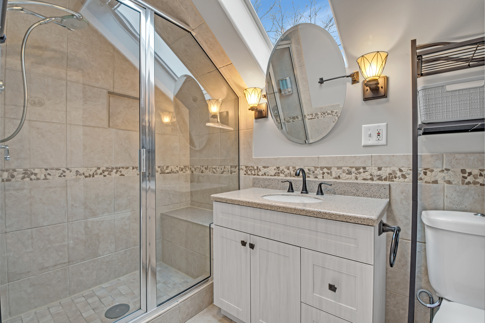 657 Chestnut Street Deerfield, IL 60015 - Photo 9 of 25 a bathroom with a sink a toilet and shower