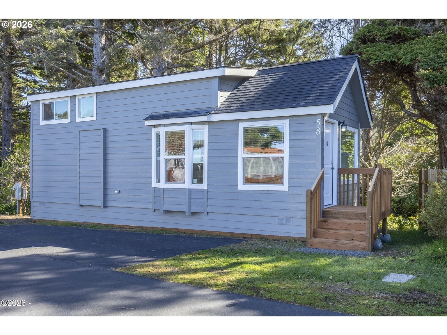4875 Highway 101, Unit 58 Depoe Bay, OR 97341 - Photo 26 of 27 a view of front of house with a yard