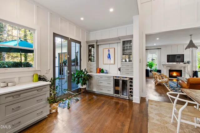 a room with furniture a flat screen tv and a fireplace