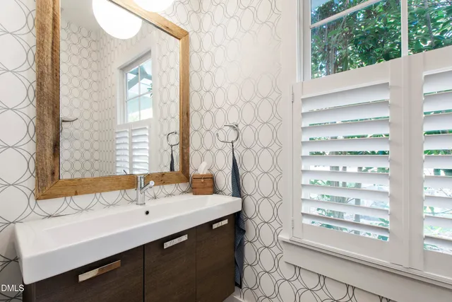 a bathroom with a sink double vanity and a mirror