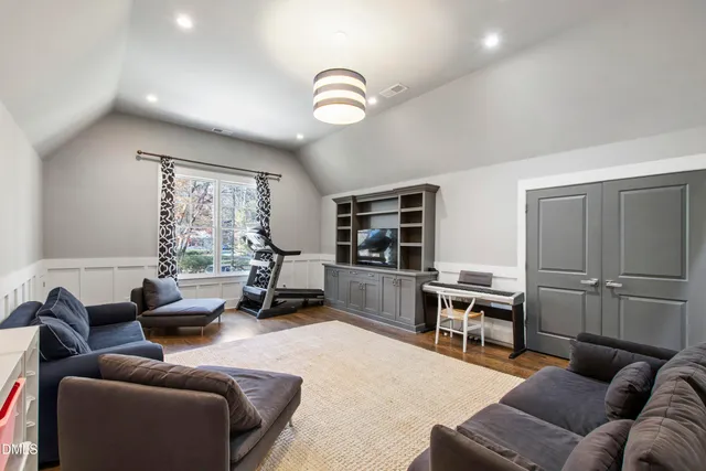 a living room with furniture a window and kitchen view