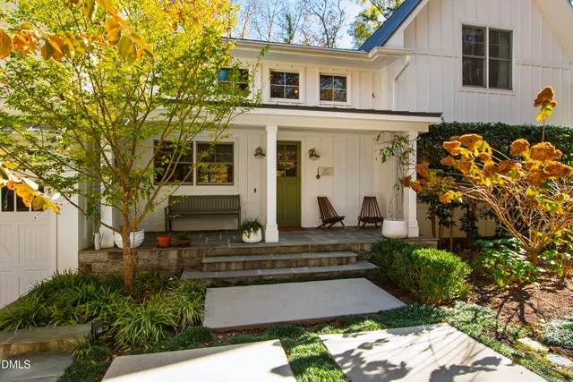 a front view of a house with garden