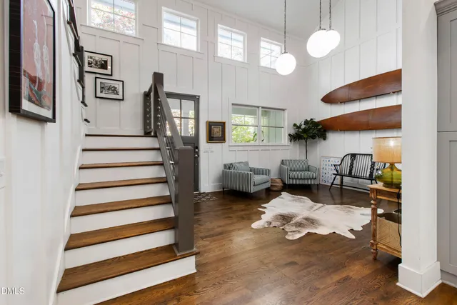a living room with furniture window and wooden floor
