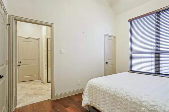 a bathroom with a toilet a sink and a mirror
