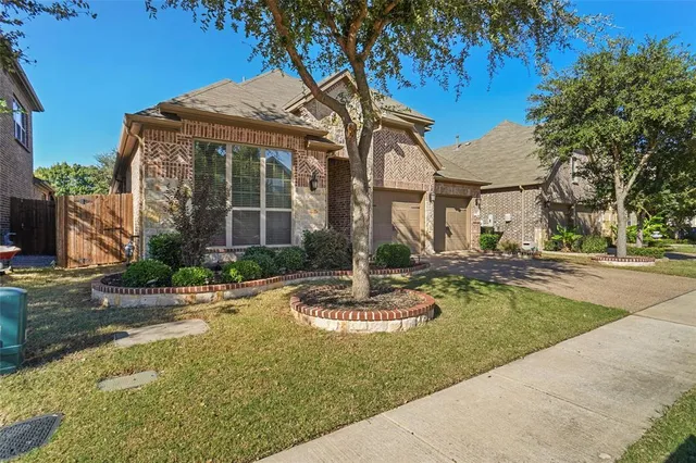 a front view of a house with swimming pool yard and patio