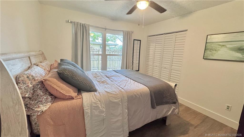 323 Southwest Ridge Lane Stuart, FL 34994 - Photo 12 of 18 a bedroom with a bed and a window