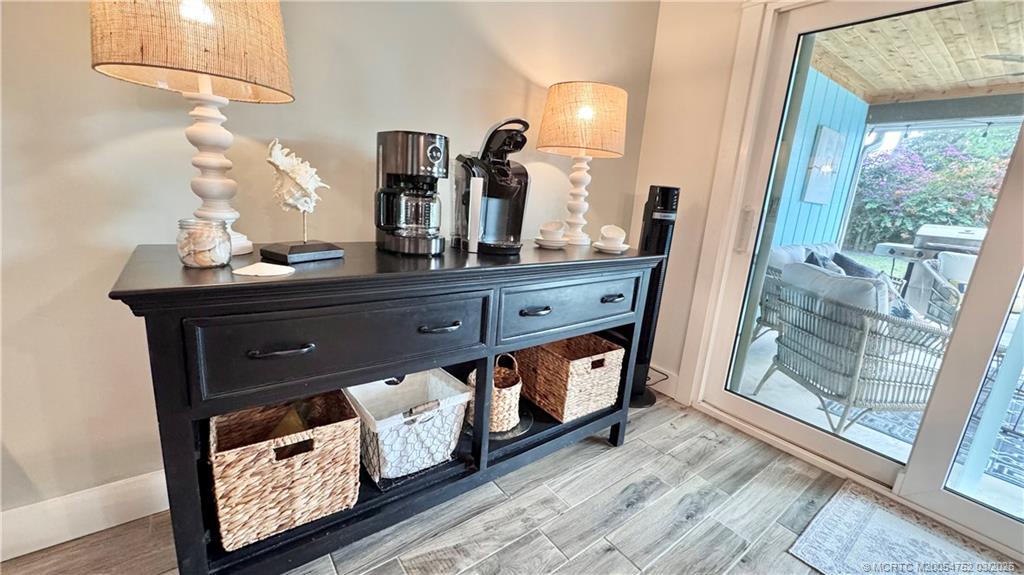 323 Southwest Ridge Lane Stuart, FL 34994 - Photo 16 of 18 a room with round mirror and furniture