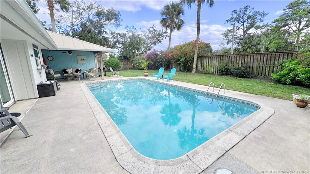 323 Southwest Ridge Lane Stuart, FL 34994 - Photo 18 of 18 a view of a swimming pool with a patio