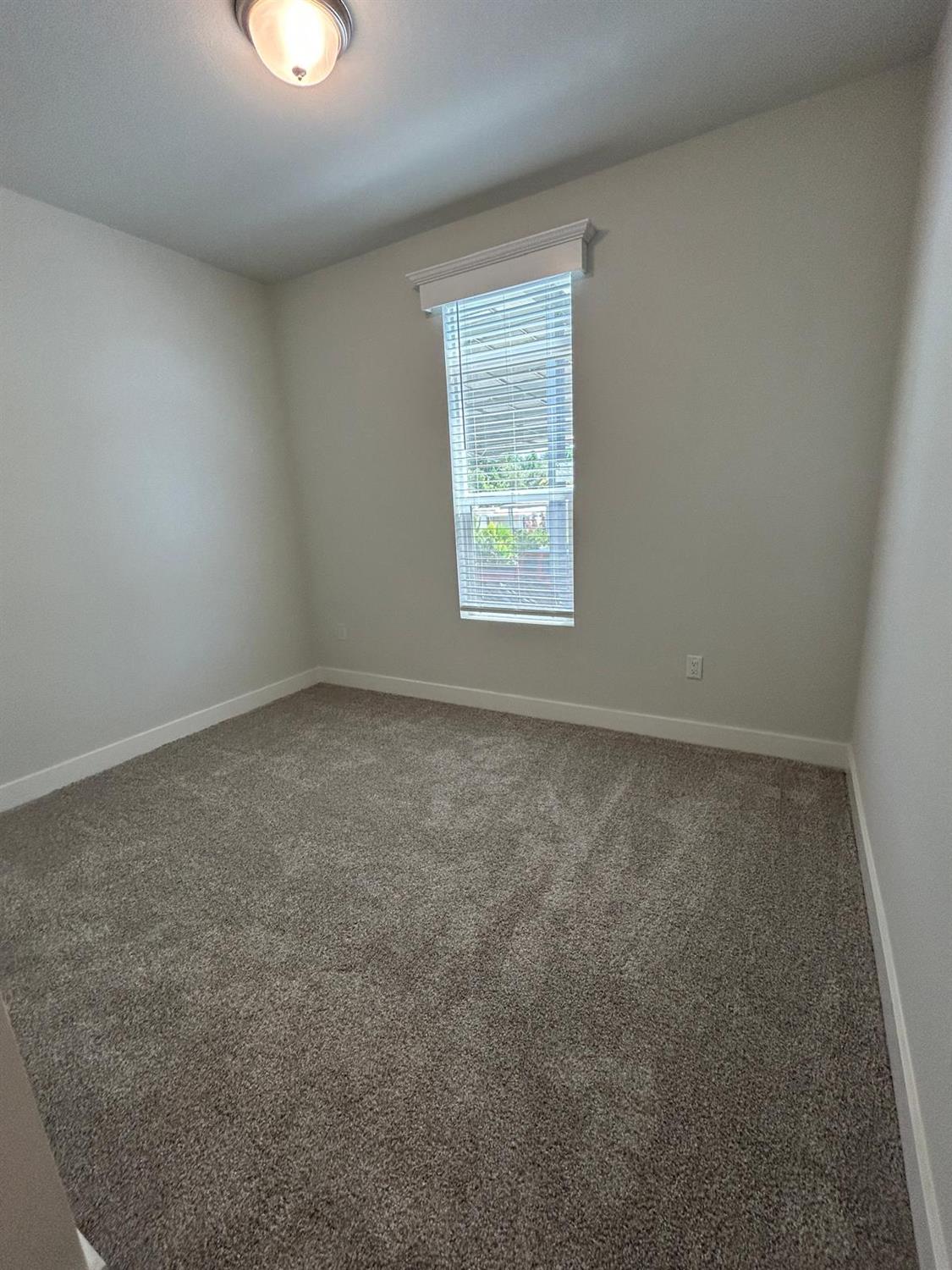 9060 Auburn Folsom Road, Unit 25 Granite Bay, CA 95746 - Photo 15 of 29 an empty room with a window