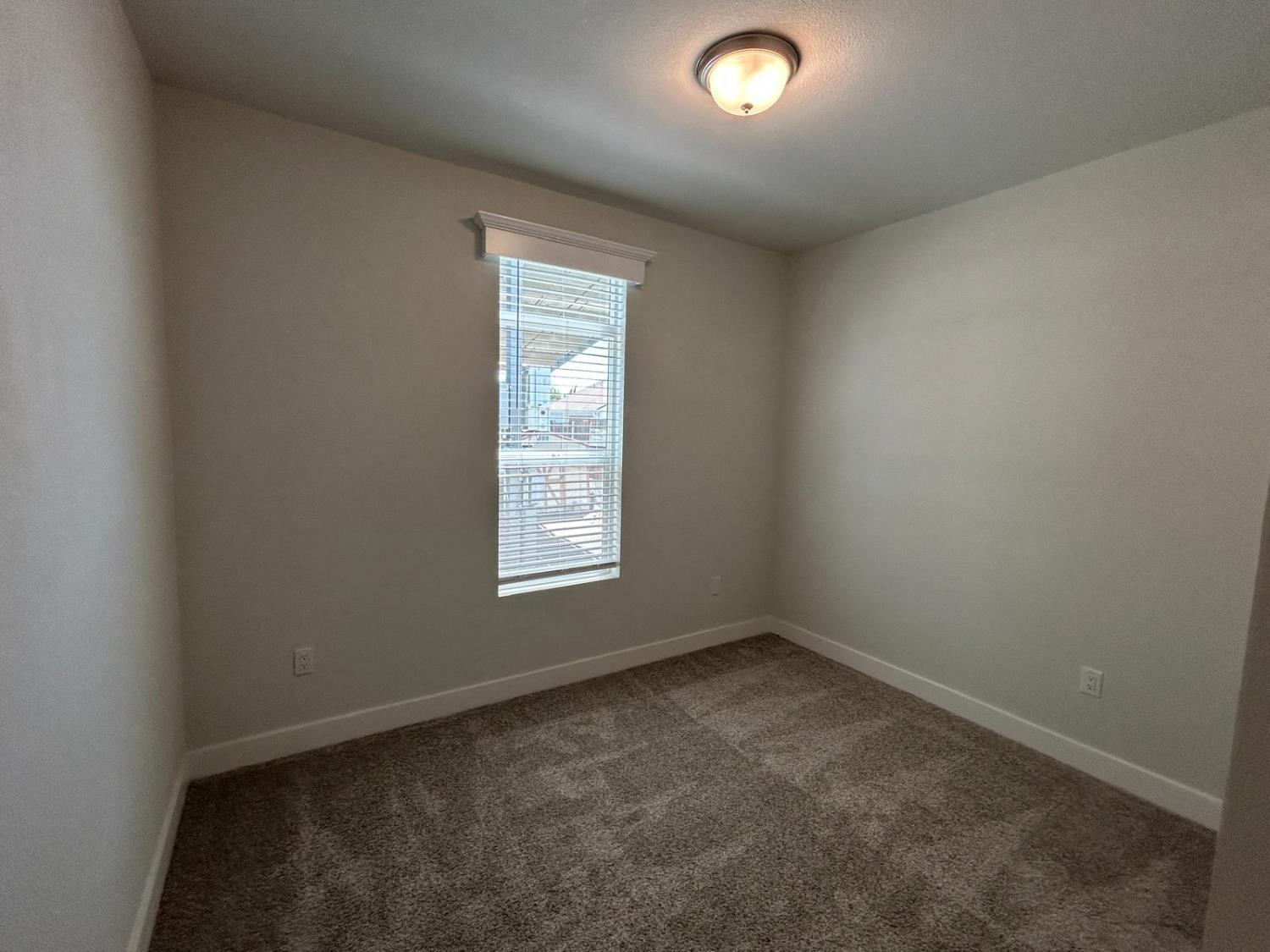 9060 Auburn Folsom Road, Unit 25 Granite Bay, CA 95746 - Photo 17 of 29 an empty room with a window