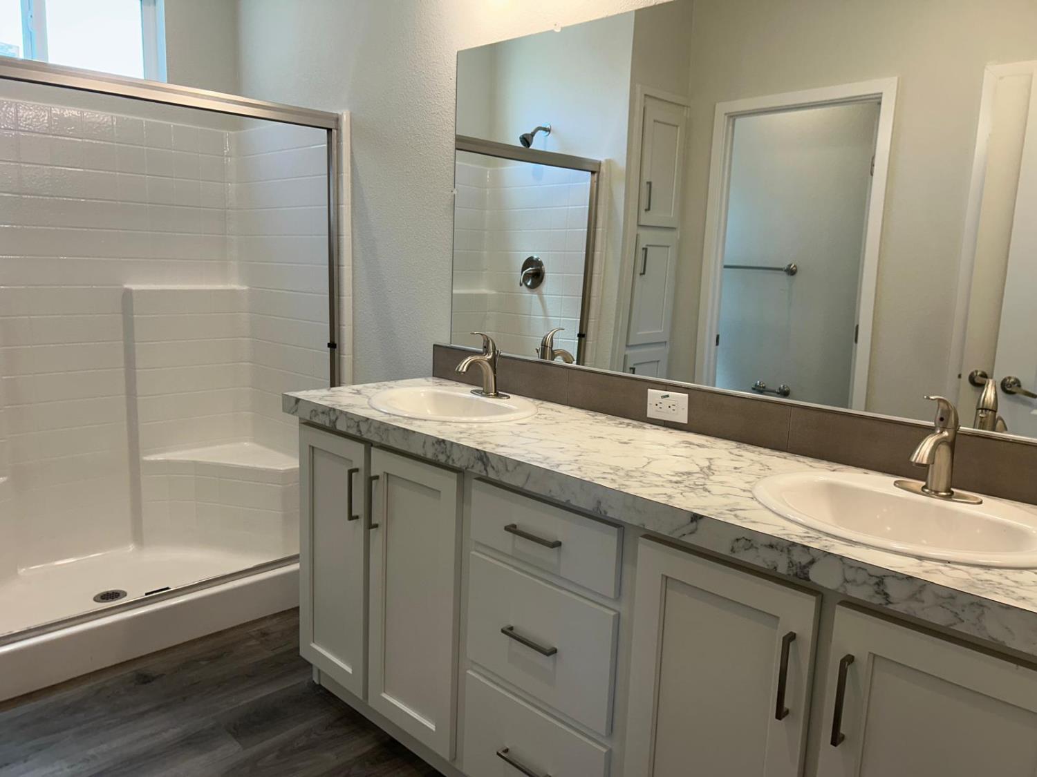 9060 Auburn Folsom Road, Unit 25 Granite Bay, CA 95746 - Photo 23 of 29 a bathroom with a granite countertop sink mirror and double