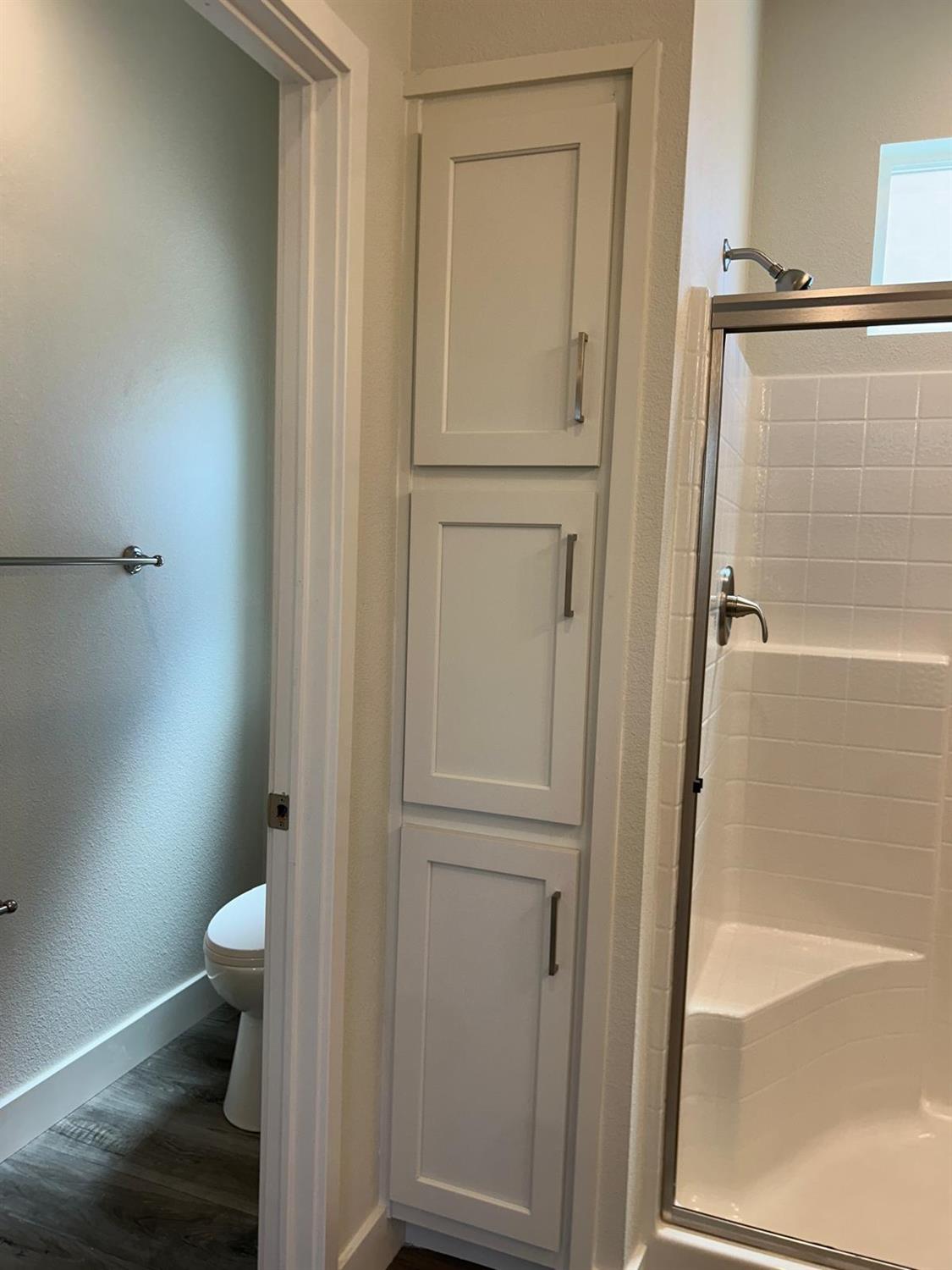 9060 Auburn Folsom Road, Unit 25 Granite Bay, CA 95746 - Photo 26 of 29 a bathroom with a glass door shower