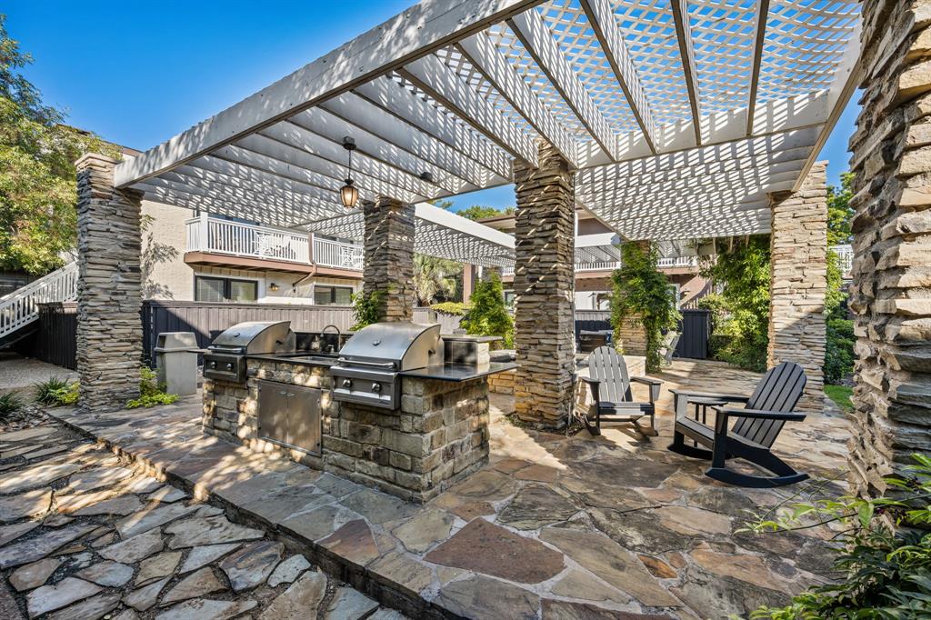 5934 Sandhurst Lane, Unit 109 Dallas, TX 75206 - Photo 11 of 15 a view of a backyard with sitting area