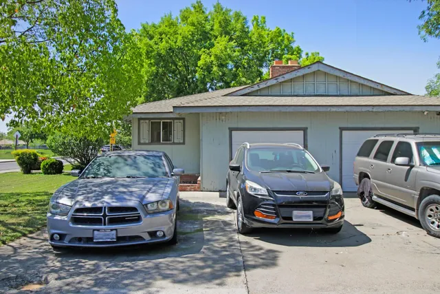 a car parked in front of a house