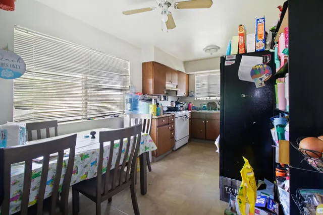 a kitchen with a sink cabinets and window
