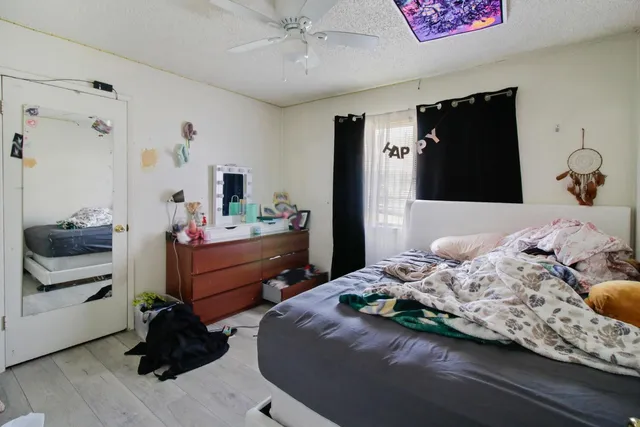 a bathroom with a sink mirror and vanity