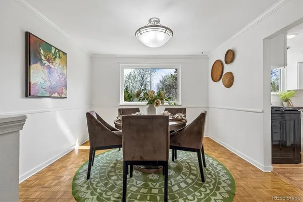 a view of a dining room with furniture and window