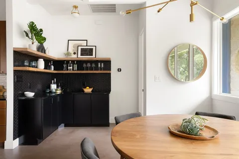 a dining room with furniture and window