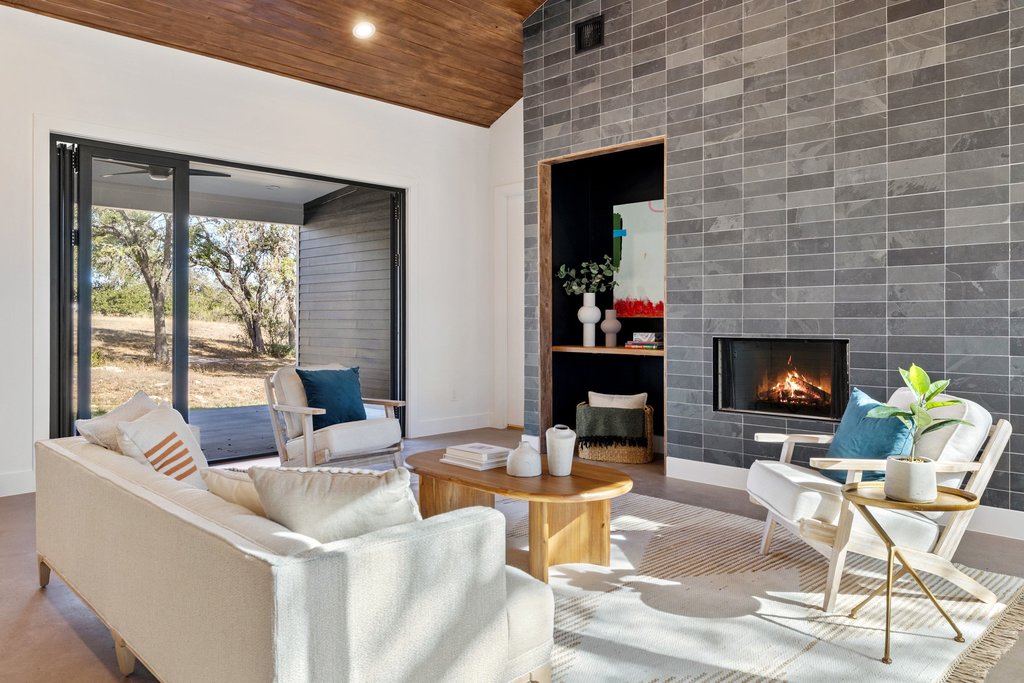 47 War Bonnet Wimberley, TX 78676 - Photo 16 of 40 Living area featuring a tiled fireplace, wooden ceiling, high vaulted ceiling, wood finished floors, and recessed lighting