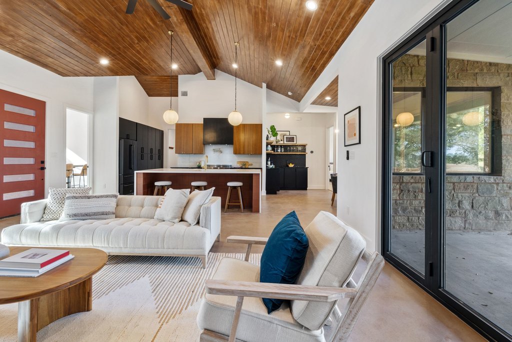47 War Bonnet Wimberley, TX 78676 - Photo 17 of 40 Living room with high vaulted ceiling, a wood ceiling with exposed beams, and ceiling fan