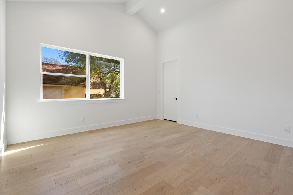 47 War Bonnet Wimberley, TX 78676 - Photo 28 of 40 Spare room featuring high vaulted ceiling, light wood-style floors, beam ceiling, and recessed lighting