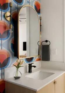 a bathroom with a sink and a mirror