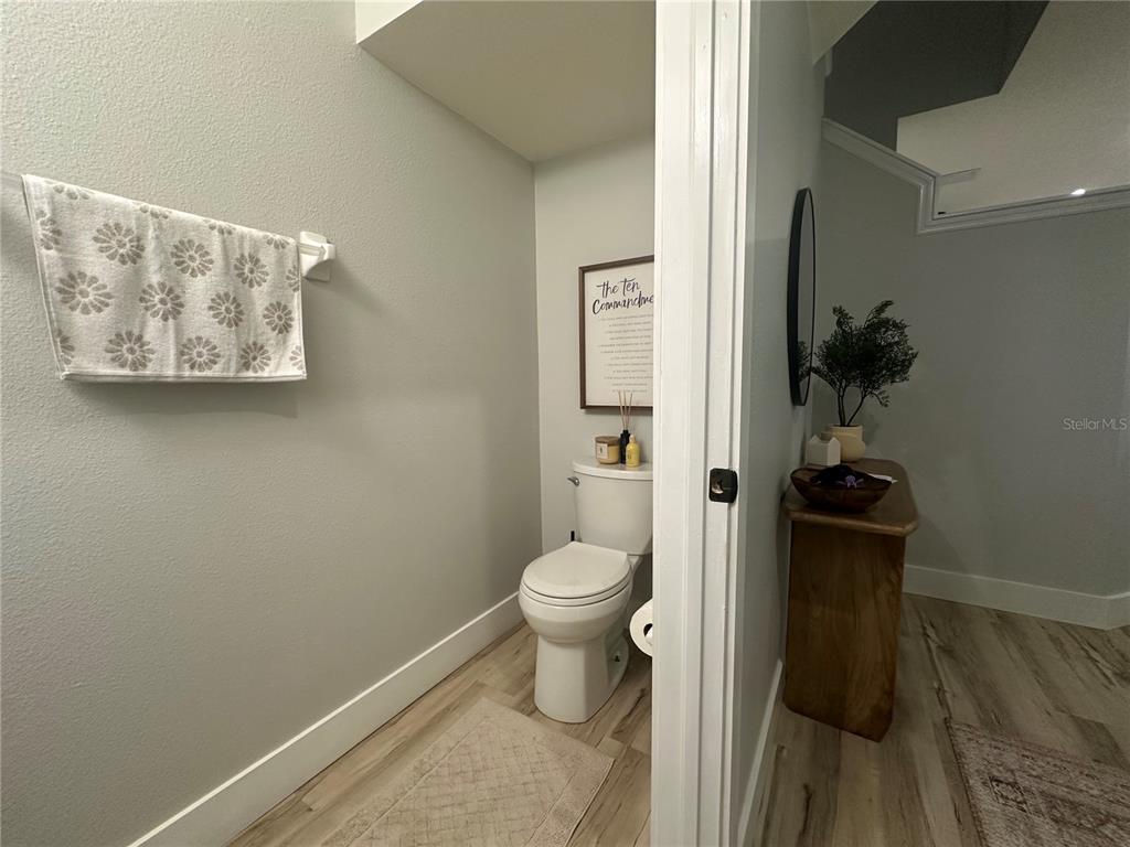 7544 Red Mill Circle New Port Richey, FL 34653 - Photo 13 of 31 a bathroom with a toilet and a sink